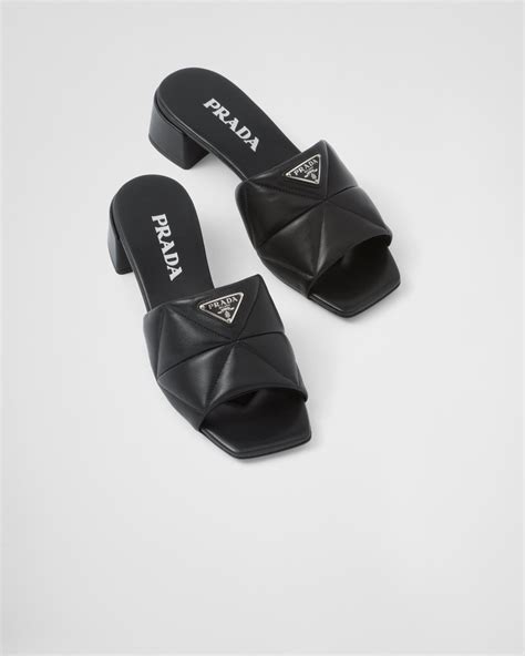 prada quilted nappa leather slides.